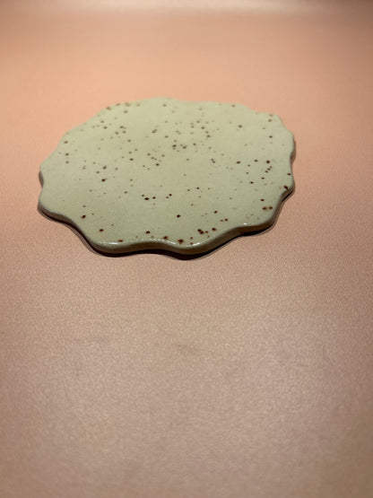 Dessous de plat en céramique moucheté